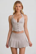 Low-Rise Pleated Mini Skirt in Ecru